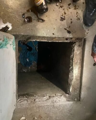 Menina estava trancada em um alçapão com tampa de concreto e caixas de cerveja em cima