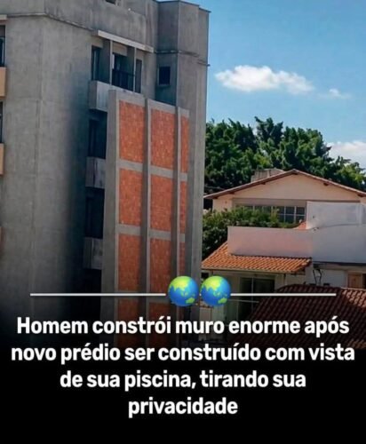Homem constrói muro enorme após novo prédio ser construído com vista de sua piscina, tirando sua privacidade