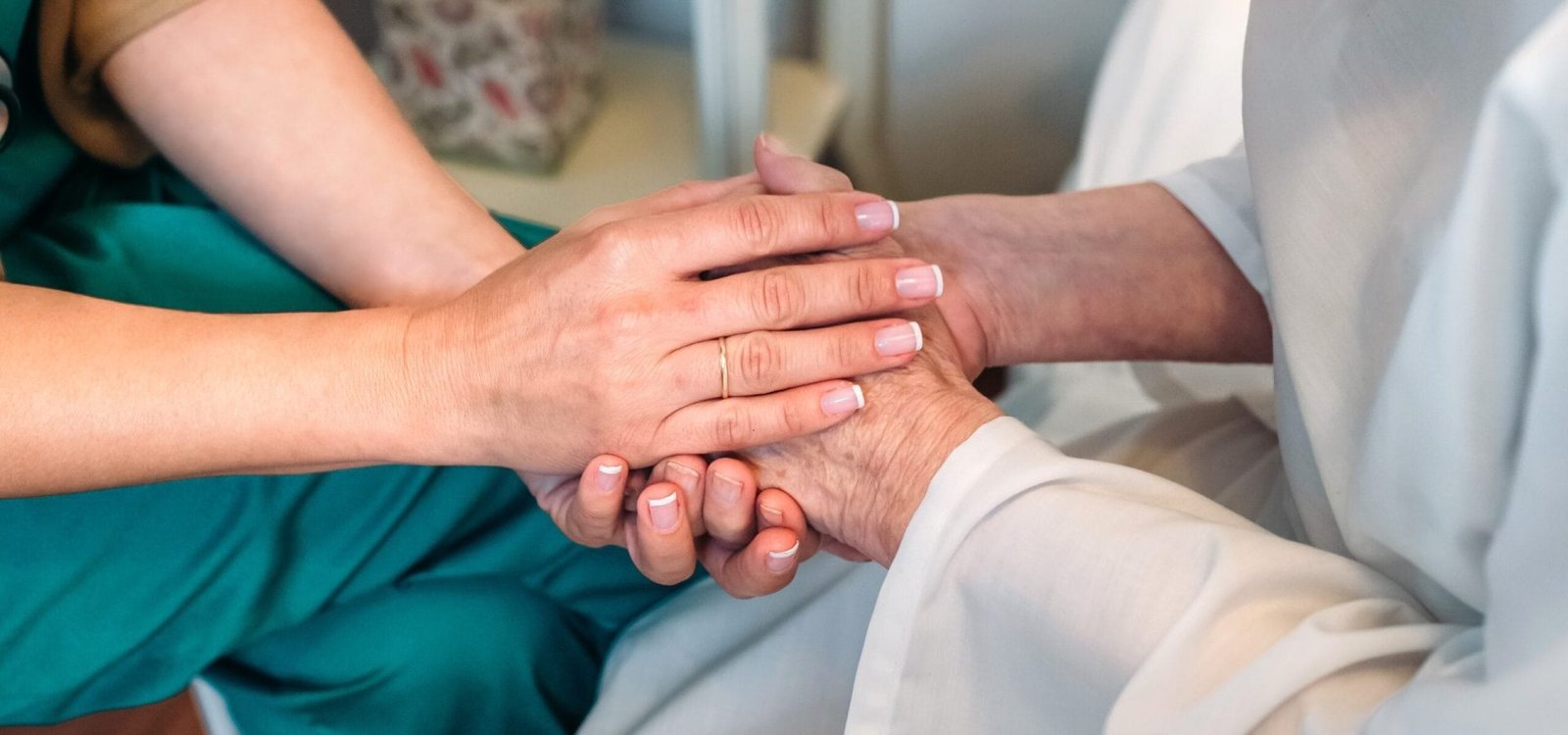 Doctor giving encouragement to elderly patient
